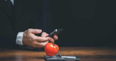 Online internet romance scam or swindler in website application dating concept, Love is bait or victim, Red heart in a rat trap, Young business people using mobile phone searching love dating girl friend on internet.